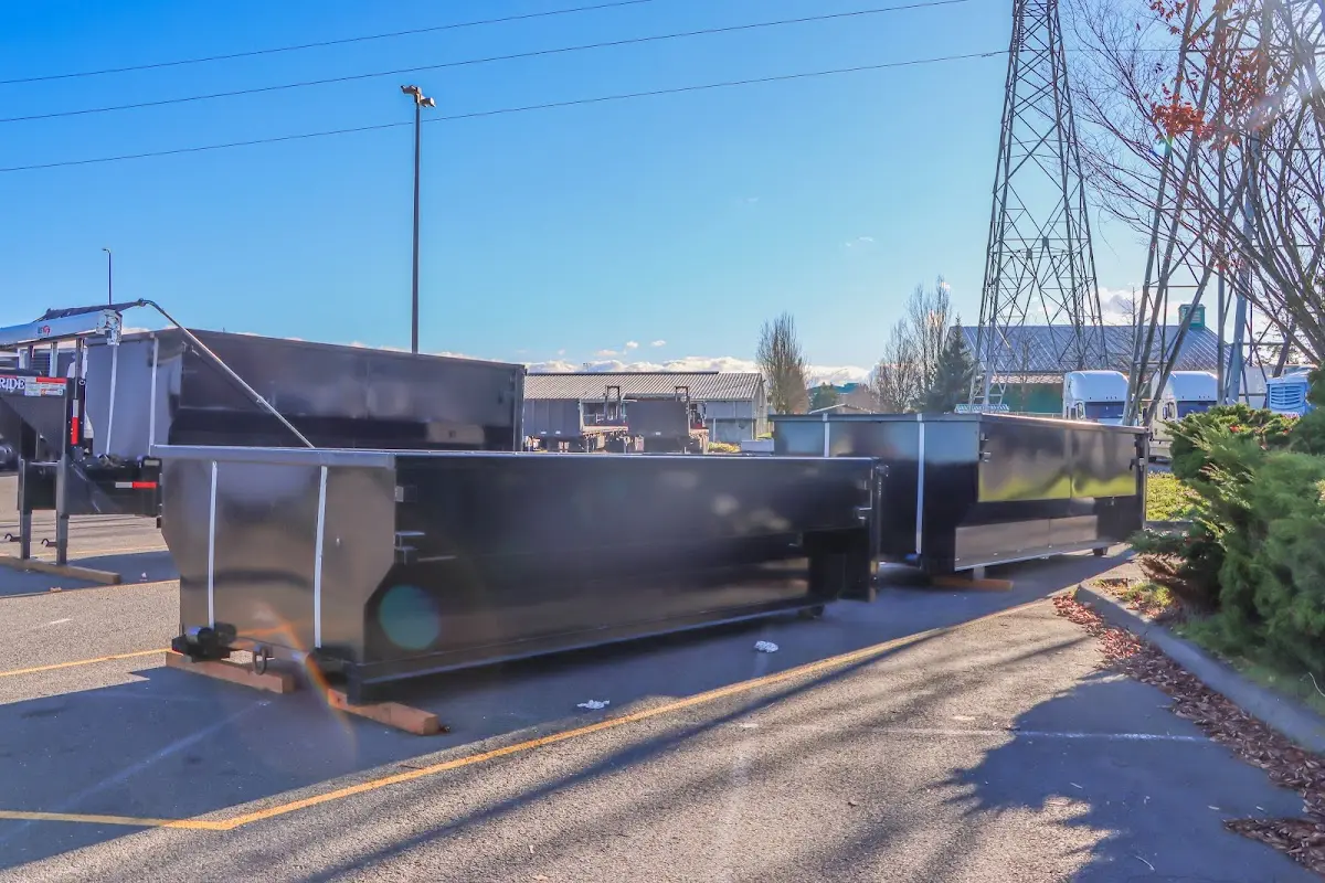 Roll-off dumpster ready for waste disposal at job site for Concrete Dumpster Rental in Fairview